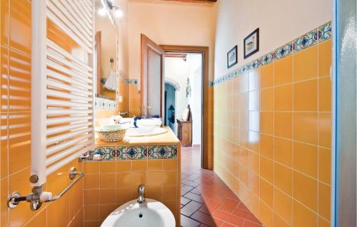a bathroom with a toilet and a sink at Piazzale 2 in Castellina in Chianti