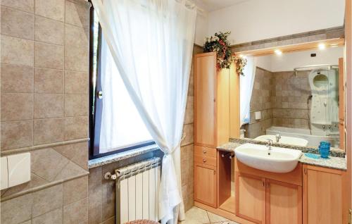 a bathroom with a sink and a mirror at Villa Primula in Casale Corte Cerro