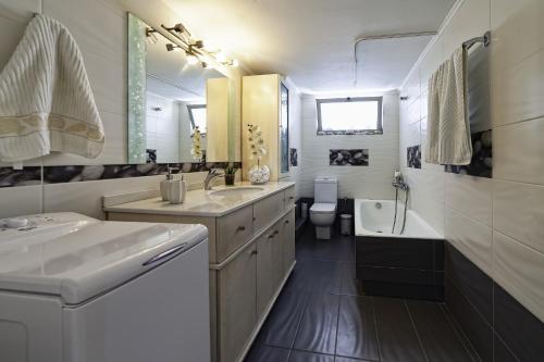 Kylpyhuone majoituspaikassa Luxury Apartment Stella