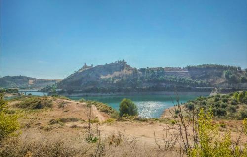a view of a lake with a mountain at Awesome Home In Iznájar in Iznájar