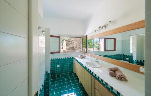 a bathroom with a sink and a mirror at Bellavista in Porto Rotondo