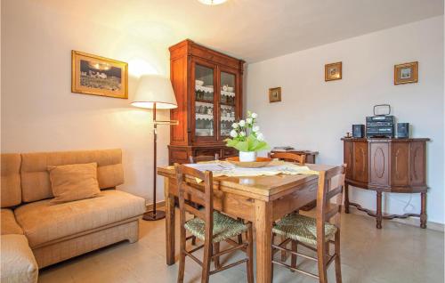 a living room with a table and a couch at Casa Fulvia in Camaiore
