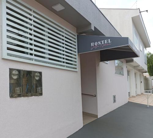 a building with a hospital sign on the side of it at Pousada Della Nonna in Presidente Prudente