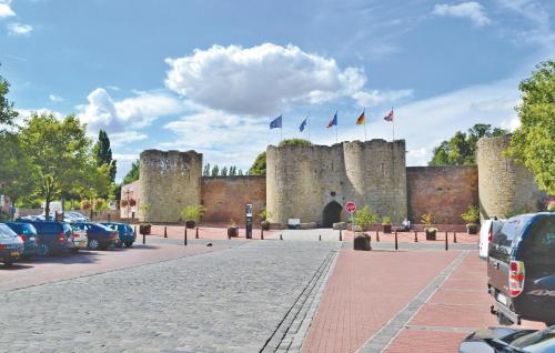 a castle with cars parked in front of it at 4 Bedroom Lovely Home In Roisel in Roisel