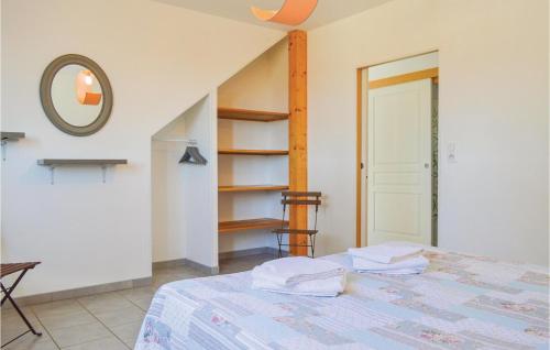 a bedroom with a bed and a mirror and shelves at 4 Bedroom Lovely Home In Roisel in Roisel
