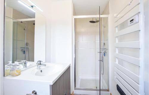 a bathroom with a sink and a shower at Stunning Home In Saint-Sever-Calvados in Saint-Sever-Calvados