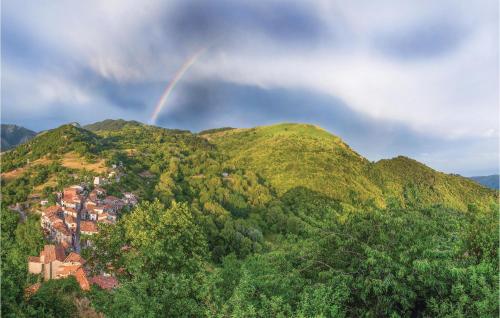 a rainbow in the sky over a mountain at Awesome Home In Montefegatesi With Wifi in Tereglio