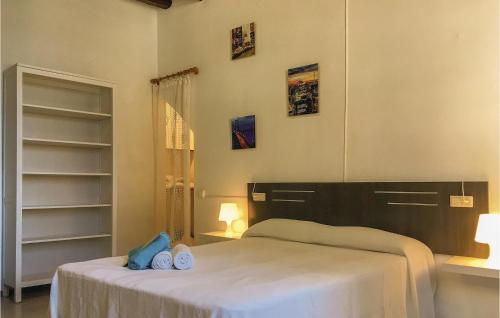 a bedroom with two beds with towels on it at 3 Bedroom Beautiful Apartment In Pineda De Mar in Pineda de Mar
