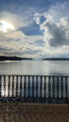 a view of a body of water with a fence at Casa vacacional Es Port in Portocolom