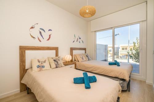 Ein Bett oder Betten in einem Zimmer der Unterkunft Villa Limo San Pedro del Pinatar