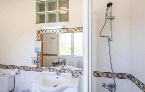 a bathroom with a shower and a sink and a mirror at Stunning Home In Torremanzanas With 4 Bedrooms, Wifi And Outdoor Swimming Pool in Torremanzanas