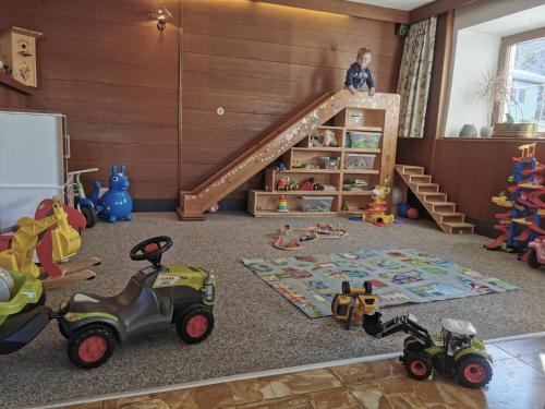 a childs room with toys on the floor at Gästehaus Sonne in Bichlbach