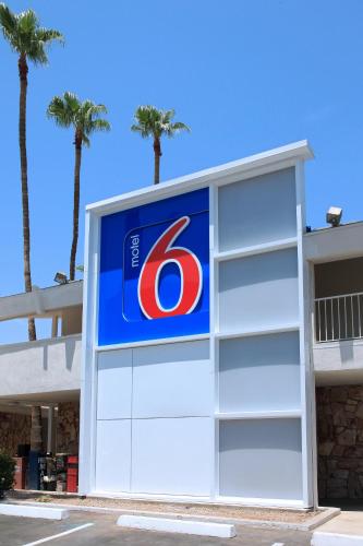 a sign for a gas station with palm trees at Motel 6 Old town Scottsdale Fashion Square in Scottsdale