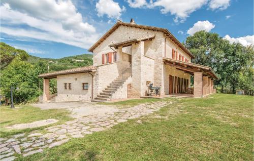 an external view of a stone house with a yard at Collonico in Stroncone