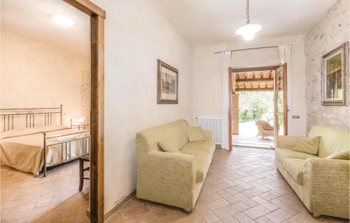a living room with two chairs and a mirror at Collonico in Stroncone