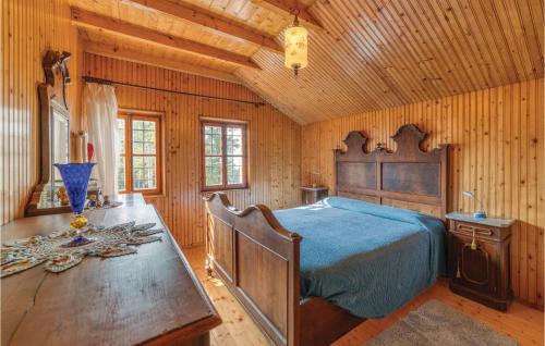 a bedroom with a bed and a wooden ceiling at Panorama Sulle Dolomiti in SantʼAntonio Tortal