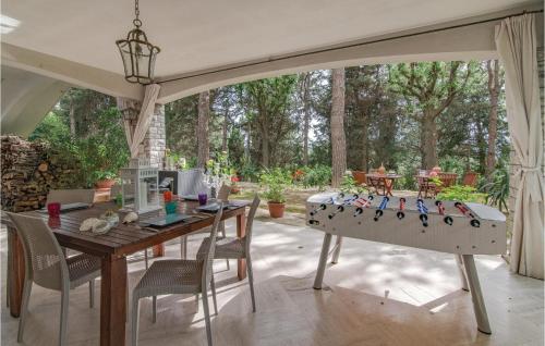 a patio with a table and a ping pong at Villa Silvana in Pesaro