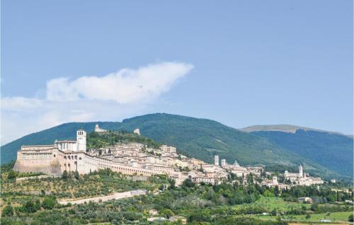 a town on top of a hill with trees at Ginestre 1 in Mengara