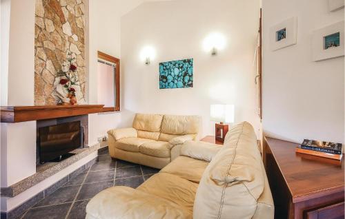 a living room with a couch and a fireplace at Lovely Home In Ca- With Wifi in Monte Nai