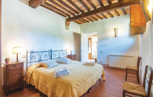 a bedroom with a large bed in a room at Schivanoia 2 in Bagno Vignoni