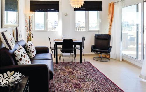 a living room with a couch and a table and chairs at Beautiful Apartment In Sucina With Wifi in Sucina