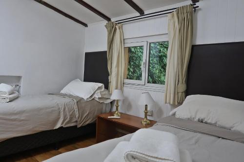 Un pat sau paturi într-o cameră la Hotel Nórdico by Nordic