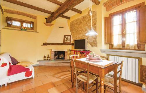 a living room with a table and a fireplace at Cantagrilli 2 in Rinecchi