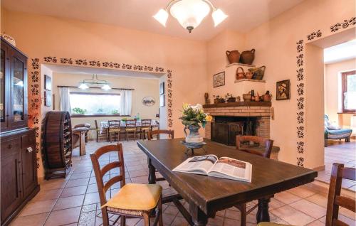 a living room with a table and a fireplace at Quadrifoglio in Configni