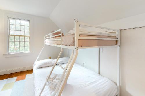 a bunk bed in a room with white walls at Wellfleet Harbor Hideaway in Wellfleet