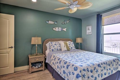 a bedroom with a bed and a ceiling fan at Beachfront Port Aransas Condo with Ocean Views! in Port Aransas