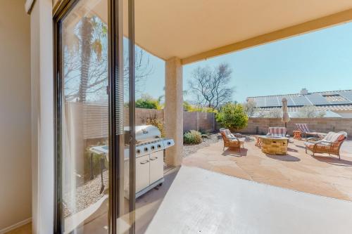 a kitchen with a stove and a patio at Bedrock Lane in Oro Valley