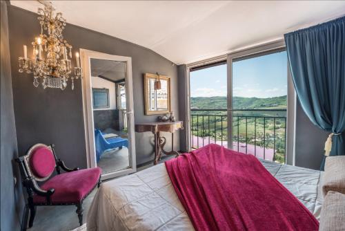 a bedroom with a bed and a window with a view at Birdhouse in Motovun