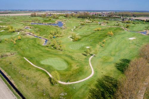 an overhead view of a golf course at "ZeeLandZon" Holiday home by the lake with Jacuzzi and Sauna in Herkingen
