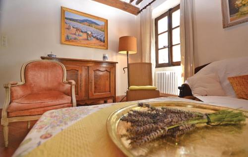 a bedroom with a table with a tray of grapes on it at 3 Bedroom Cozy Home In Sault in Sault-de-Vaucluse