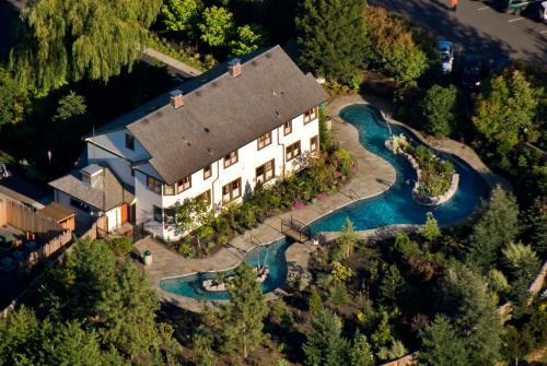 an aerial view of a large house with a river at McMenamins Edgefield in Troutdale