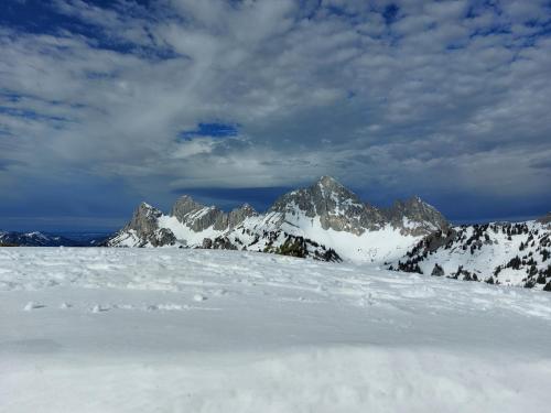 a snow covered mountain range with mountains in the background at Apart Lechtraum in Stanzach