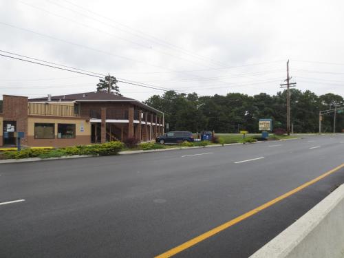 a building on the side of a road at Brick Motor Inn in Brick