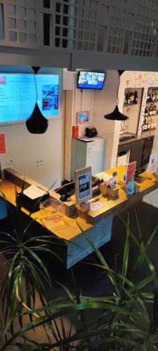 an office with a desk with a laptop computer on it at ibis Moulins in Moulins