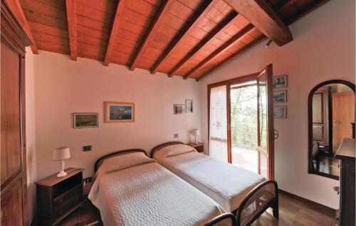A bed or beds in a room at Gorgeous Home In San Feliciano Sul T,pg With House A Panoramic View