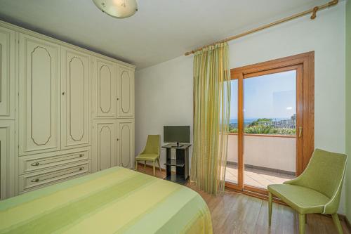 Postel nebo postele na pokoji v ubytování Appartamento villa da 6 a 8 persone Capoliveri