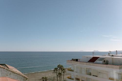 a view of the ocean from a building at Hotel Estepona Plaza in Estepona