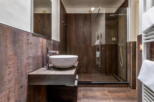 a bathroom with a sink and a shower at Baba Residences in Alassio