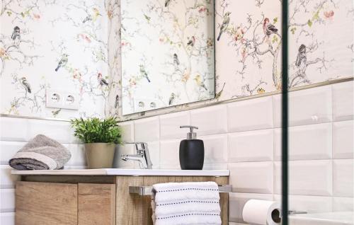 a bathroom with a sink and a mirror at Amazing Apartment In Tossa De Mar With Kitchen in Tossa de Mar