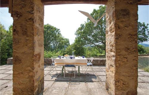 a table and chairs sitting on a patio at Poggialino in Sasso Pisano
