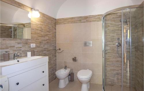a bathroom with a toilet sink and a shower at Villa Della Marchesa in Santa Croce Camerina