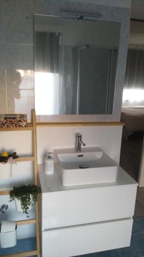 a bathroom with a sink and a mirror at Corte Disore in Rivolto