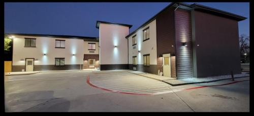an empty parking lot in front of a building at Americas Best Value Inn San Antonio Downtown Riverwalk in San Antonio