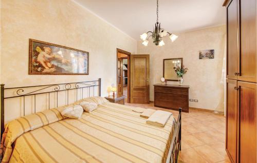 a bedroom with a large bed in a room at Lovely Apartment In Cecina Li in Fiorino