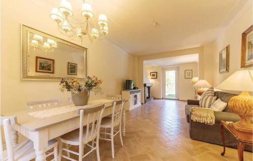 a dining room and living room with a table and chairs at La Casetta in Marcoiano