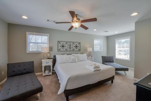 a bedroom with a bed and a ceiling fan at T-Town Cottage in Tuscaloosa